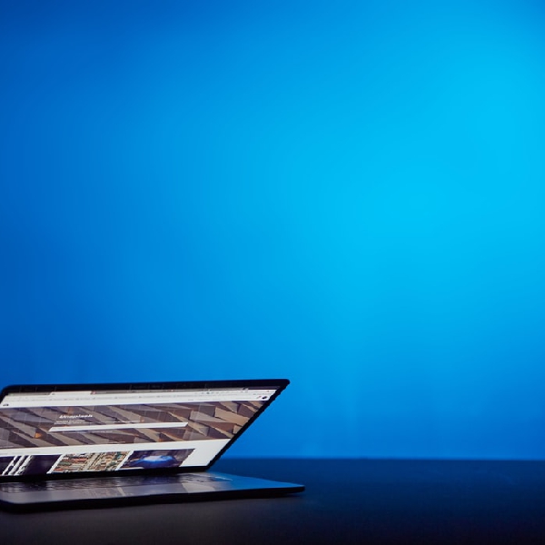 Laptop with blue background